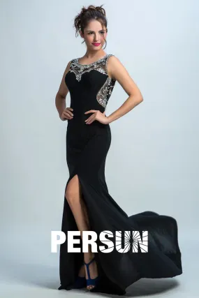 Black gala dress with round neckline, rhinestones, and side slit.